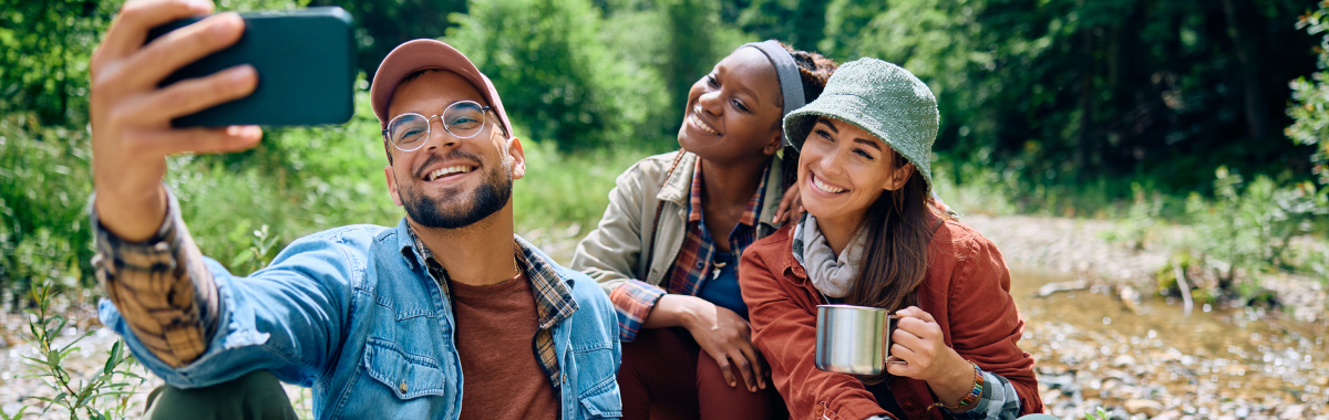 friends taking a selfie while camping