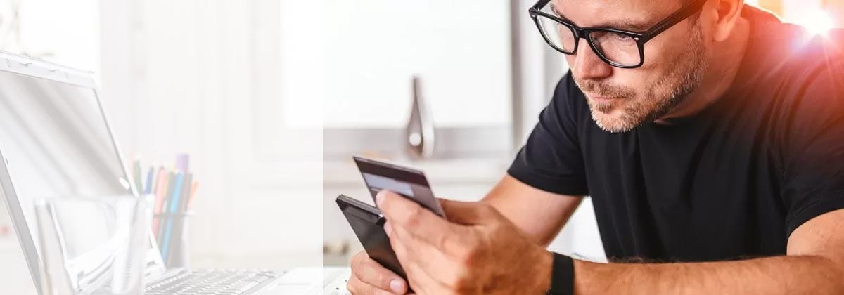 man getting a travel insurance cost quote on his phone