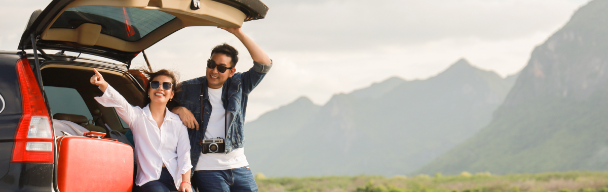 couple sight seeing from the back of their car