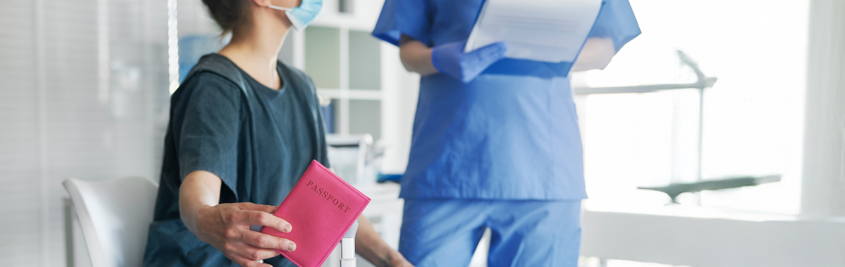 nurse talking to traveler holding passport