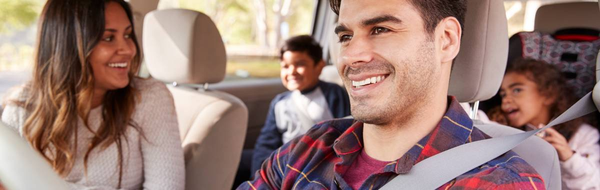 family in a car driving somewhere