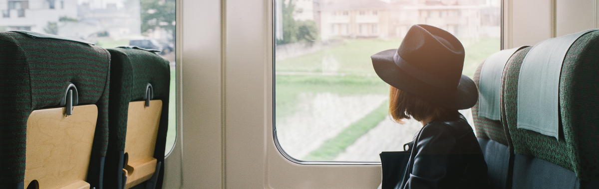 woman on a japanese train looking out the window