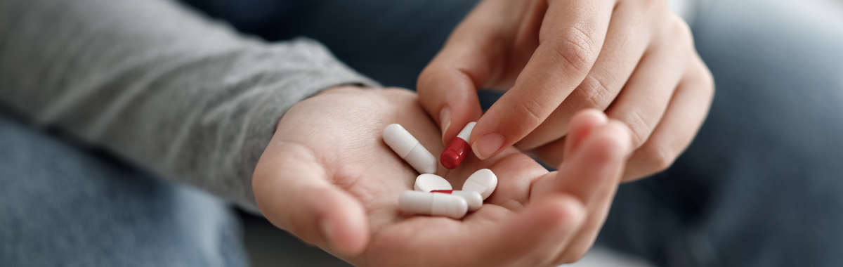 person holding their medication