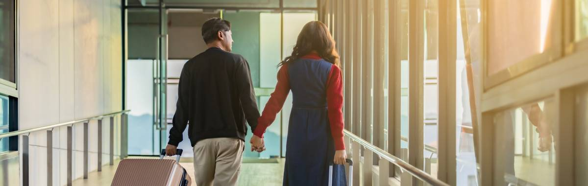 couple walking through airport together