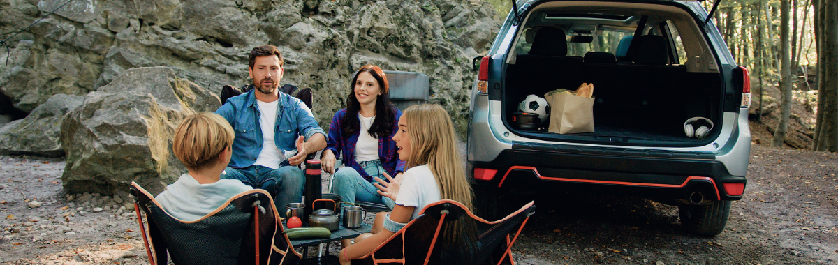 family camping next to their car