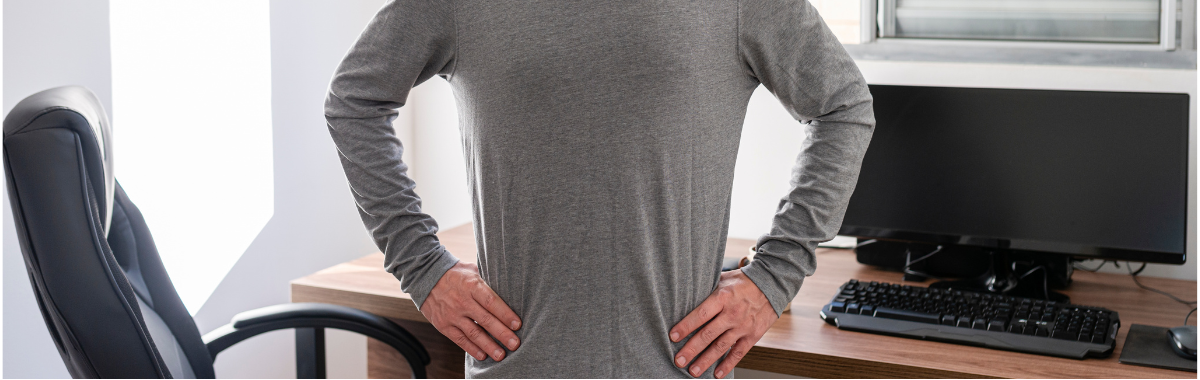 person stretching at their desk