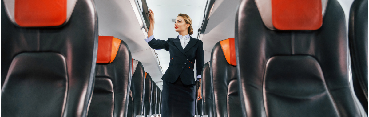 flight attendant walking down the isle of the plane