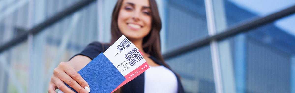woman holding plane tickets