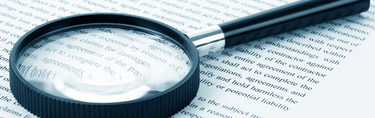 magnifying glass and fine print