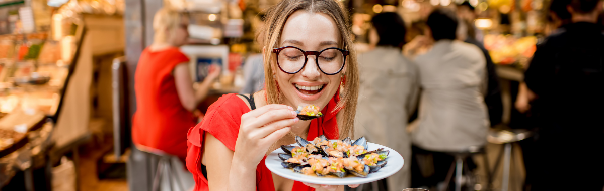 woman eating seafood
