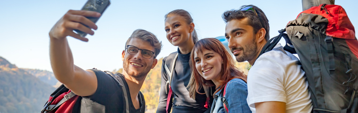 man taking selfie with other hikers