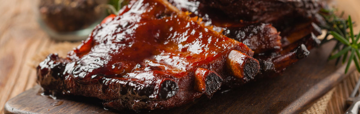 Half rack of ribs smothered in bbq sauce