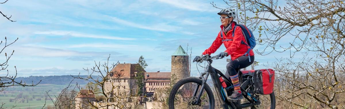 woman with beret looking at the Eiffel Tower in Paris, France