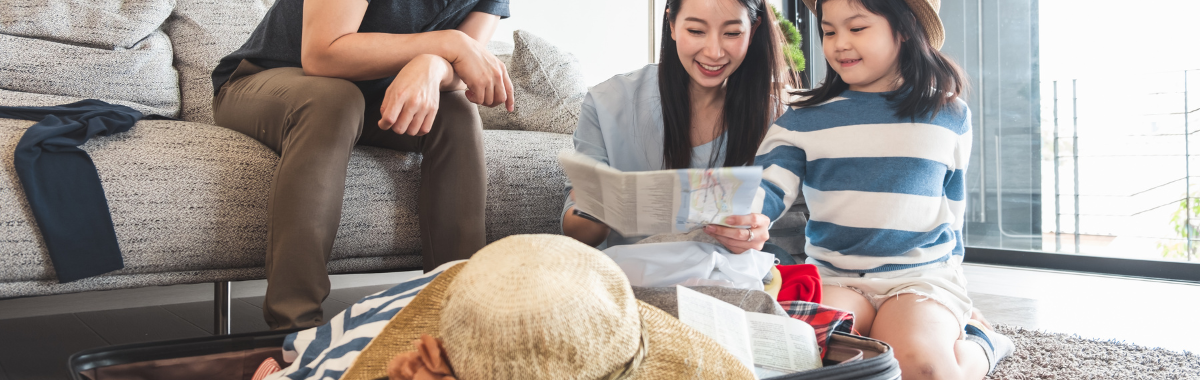 family packing and looking at a map