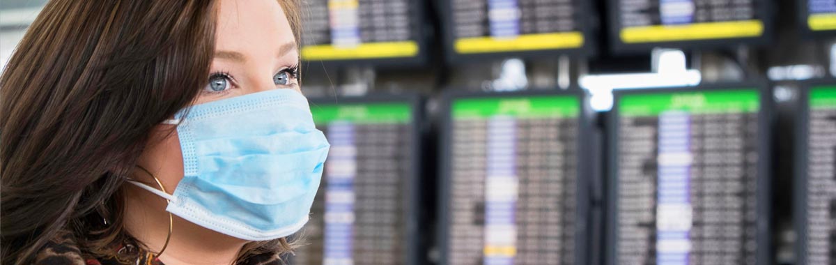 woman wearing a mask at the airport