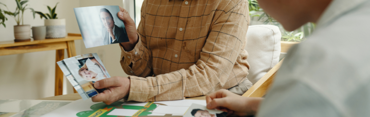 parent showing his child family photos