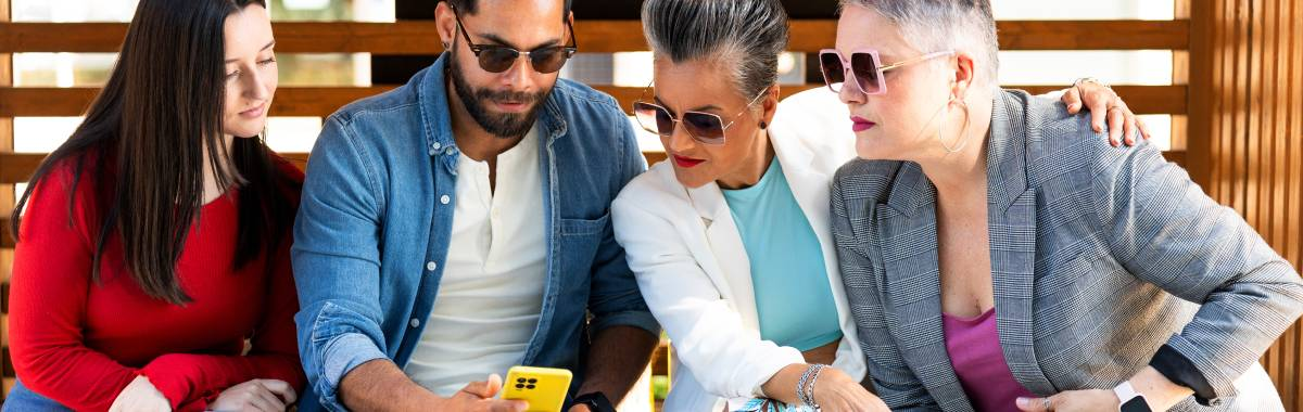 group of Gen X looking at a phone