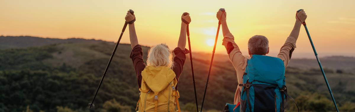 couple celebrating hiking at sunrise 
