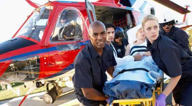 flight crew, doctor, paramedics airlifting a woman, helicopter, stretcher, medical