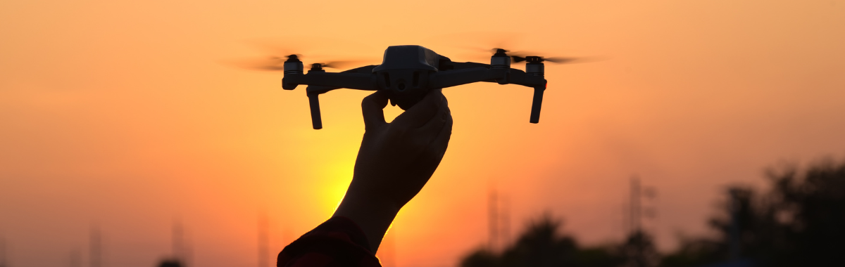 person grabbing their drone