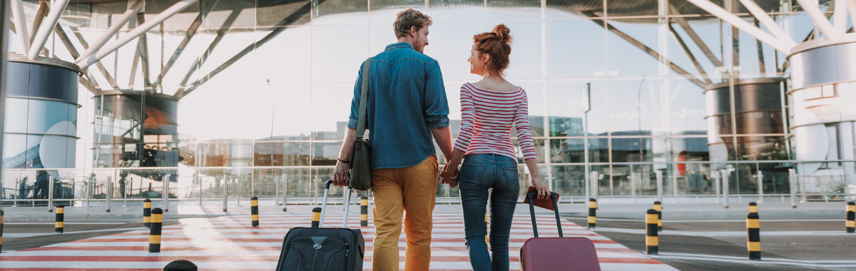 couple walking towards airport together