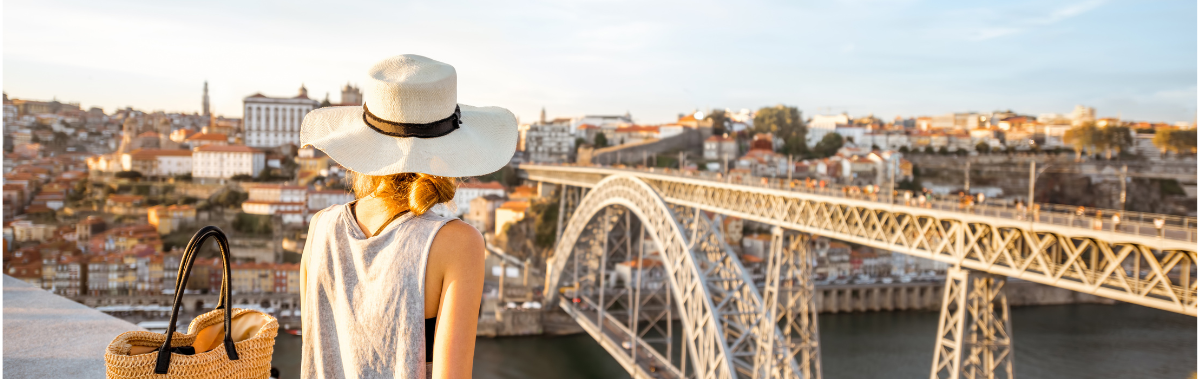 Woman overlooking city and bridge