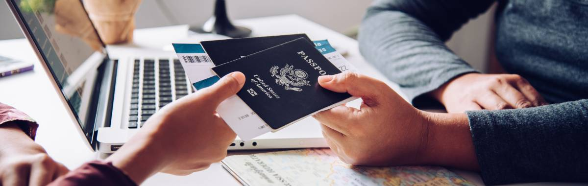person handing someone else their passport