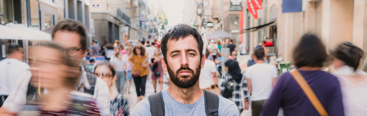 man standing in a crowd of people