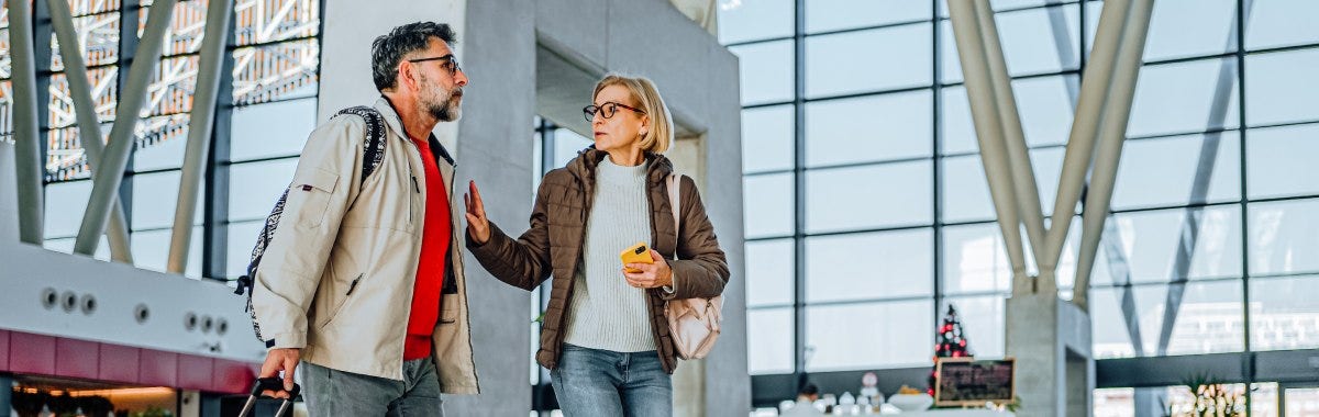 couple walking through train station