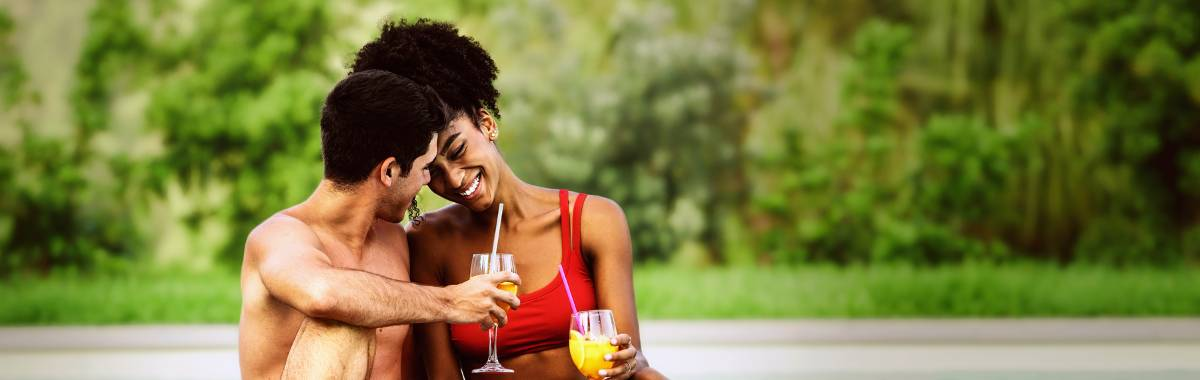 couple hanging out relaxing next to a pool
