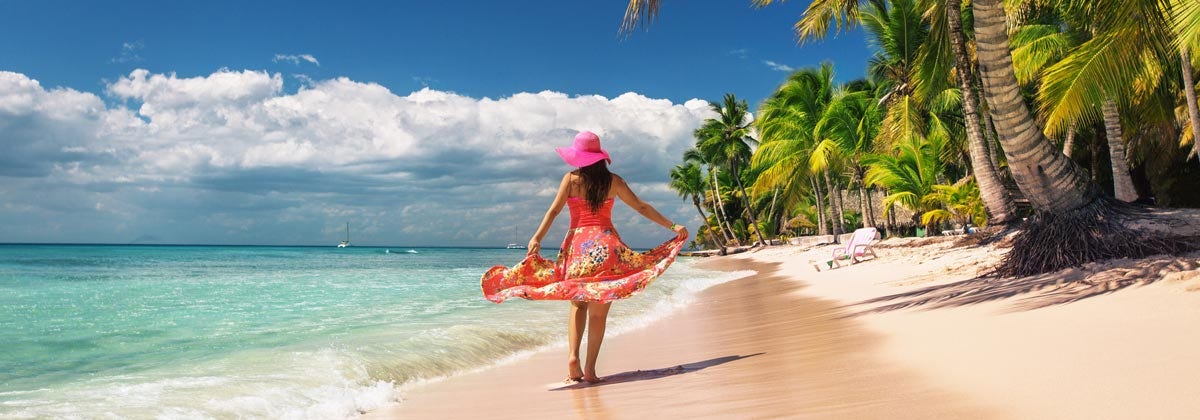 woman on a beach with a big red dress