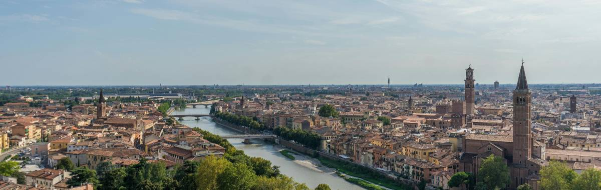 ranch with horses, trees and mountains in the distance