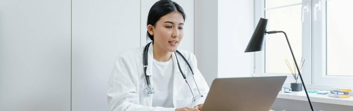 doctor talking to computer