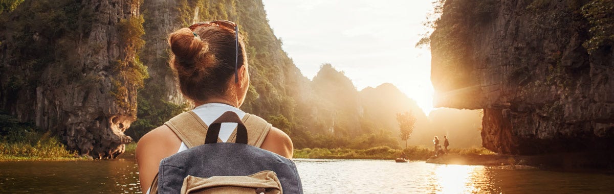 woman with beret looking at the Eiffel Tower in Paris, France
