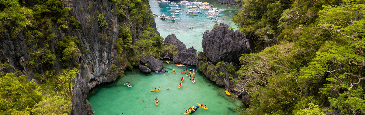 Philippines beach and water with boats and swimmers