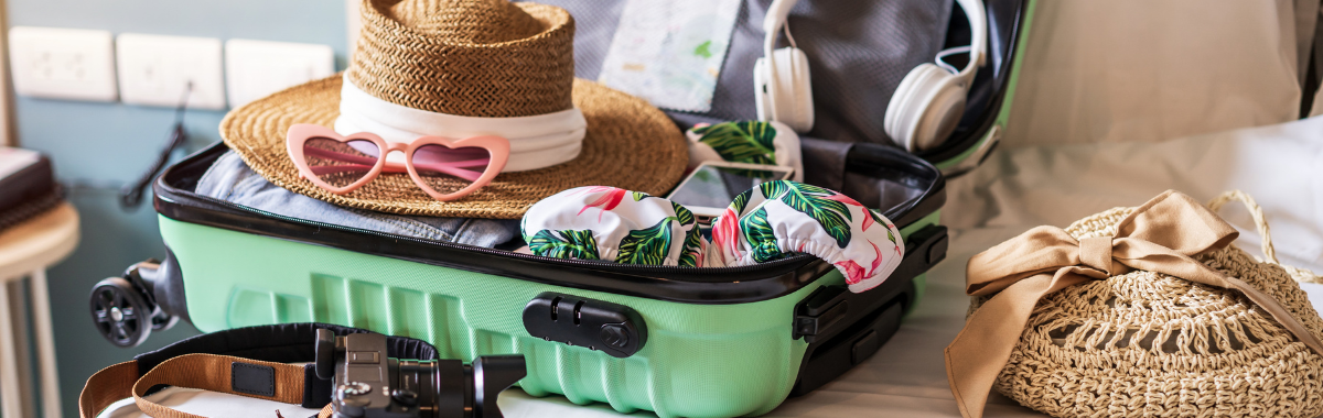 suitcase packed with clothes for a tropical getaway