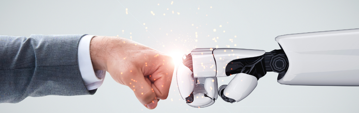 person fistbumbing robot hand