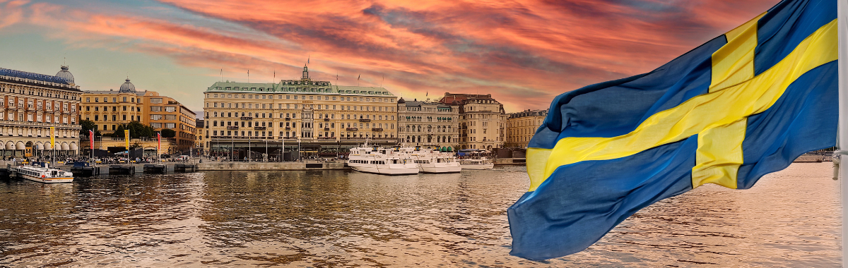 swedish town with the swedish flag nearby