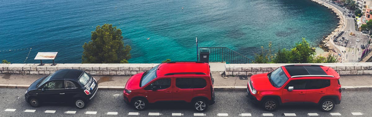 three cars on a European street