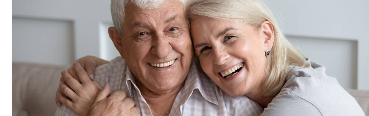 senior couple holding each other