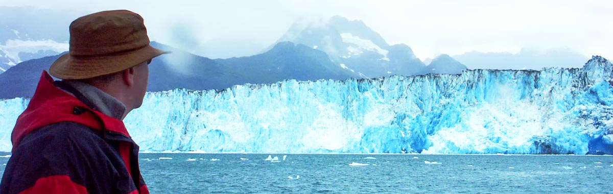 man on Alaska cruise looking at Columbia Glacier in the Prince William Sound