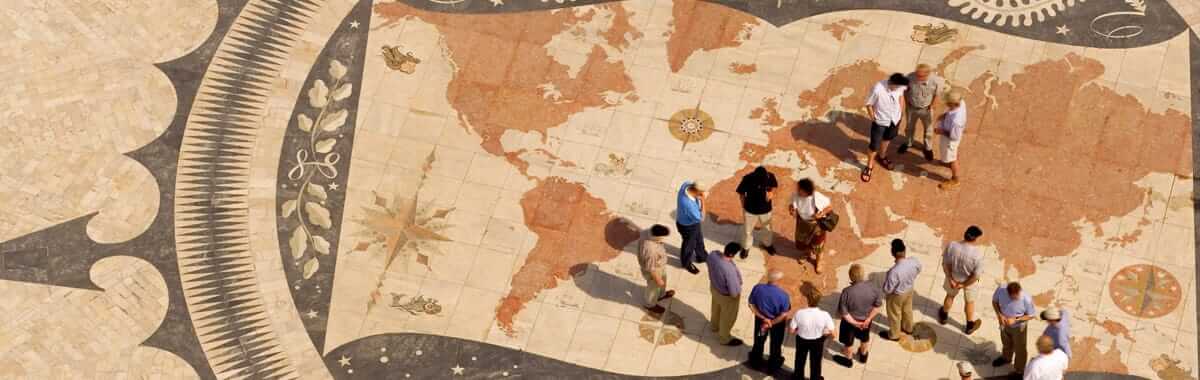 Tiled world map with people walking on it