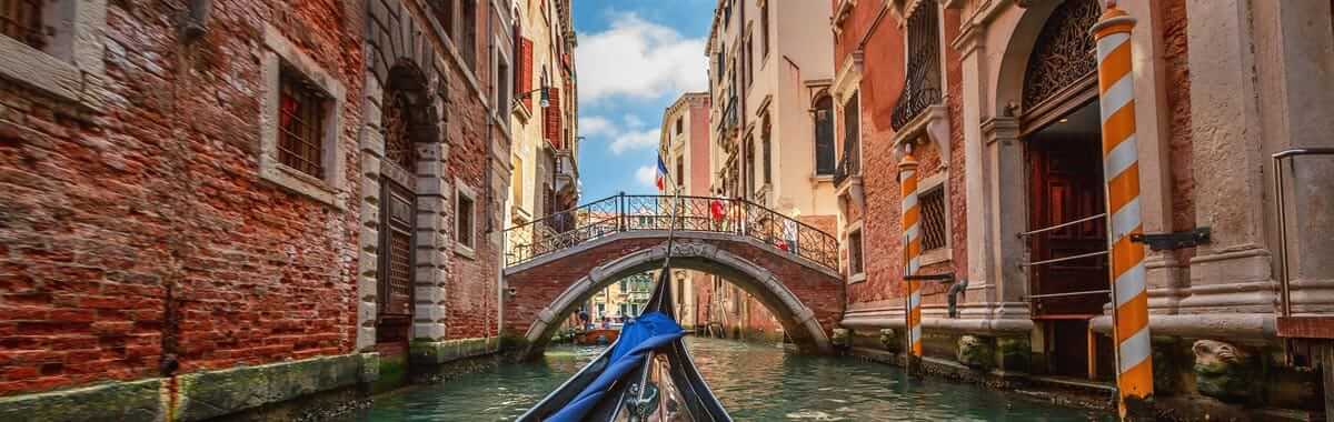 Gondola ride down the canals of Venice on a trip to Italy