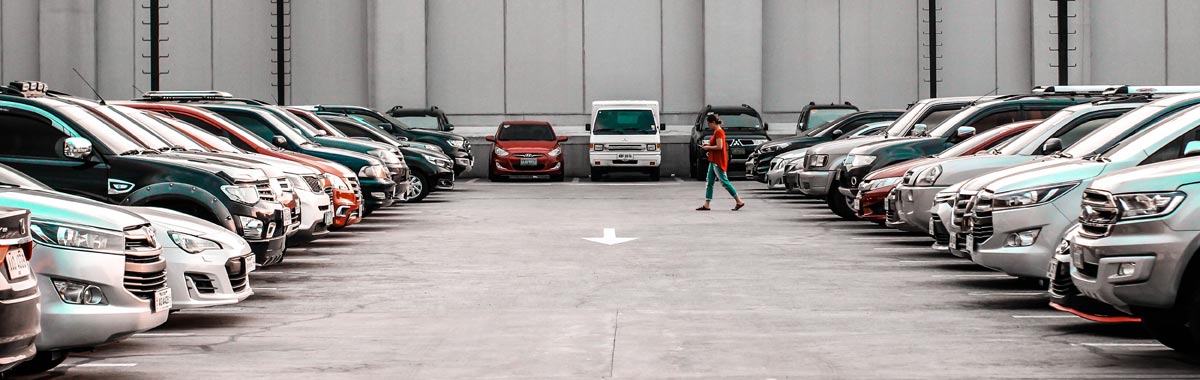 person walking in parking lot