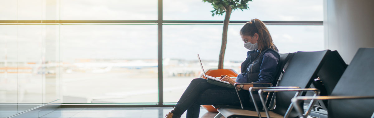 doctor using thermometer to check for COVID sickness