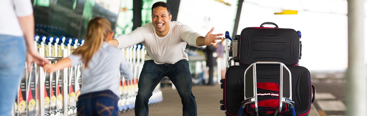 happy family reuniting at the airport