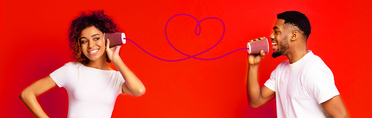 a couple talking through tin cans