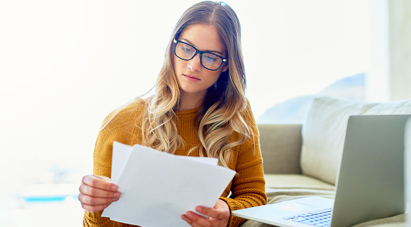 woman reading paperwork