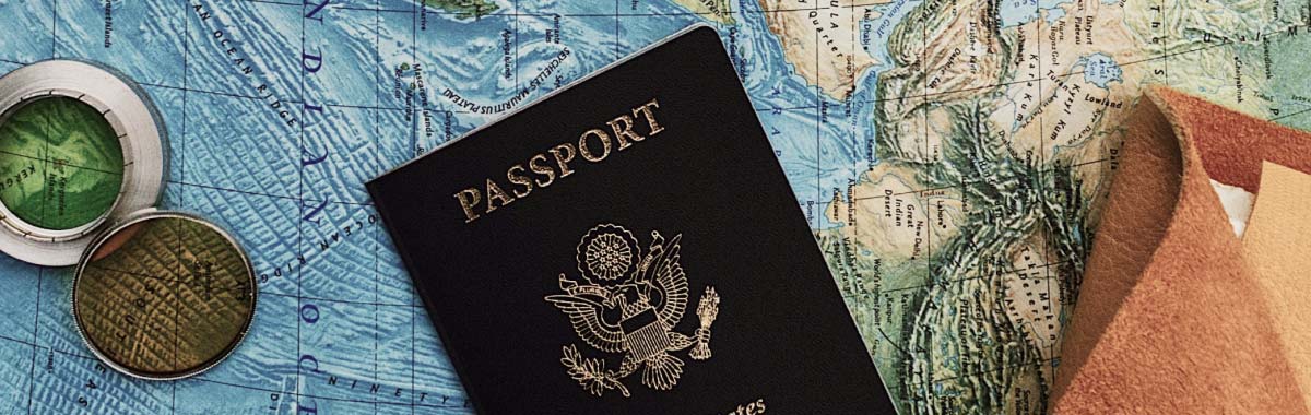 passport and money on a map