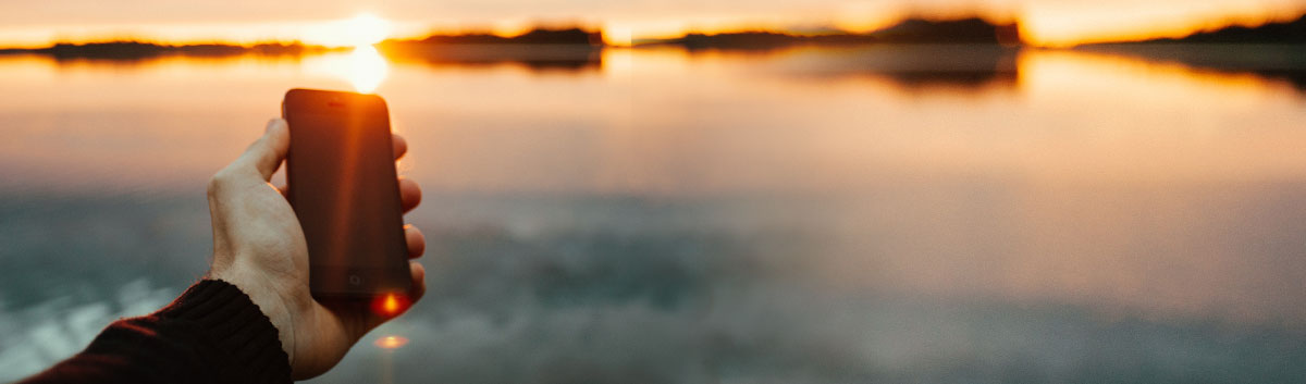 mobile phone over sunset
